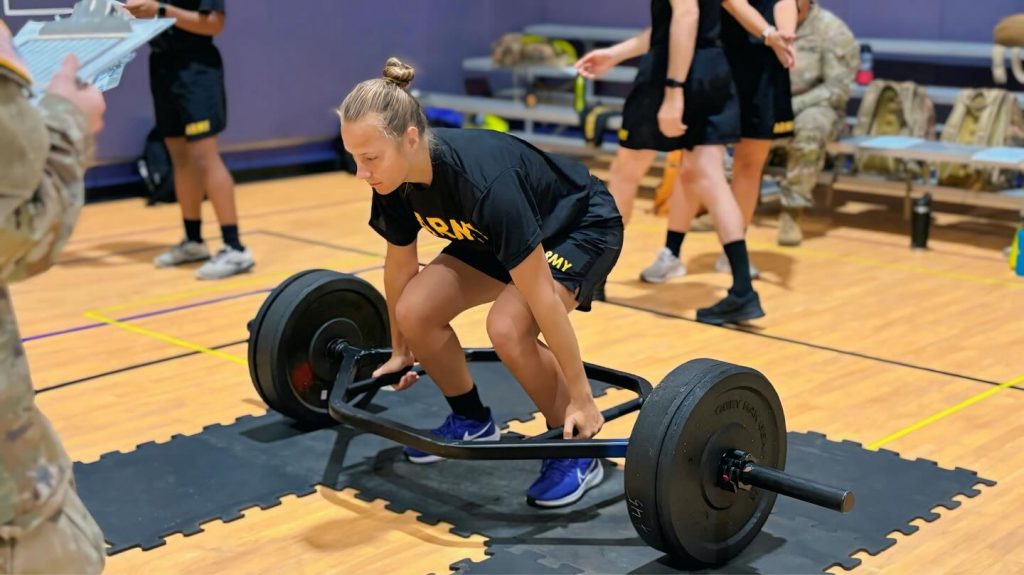 Prospective Students Cadet lifting weights