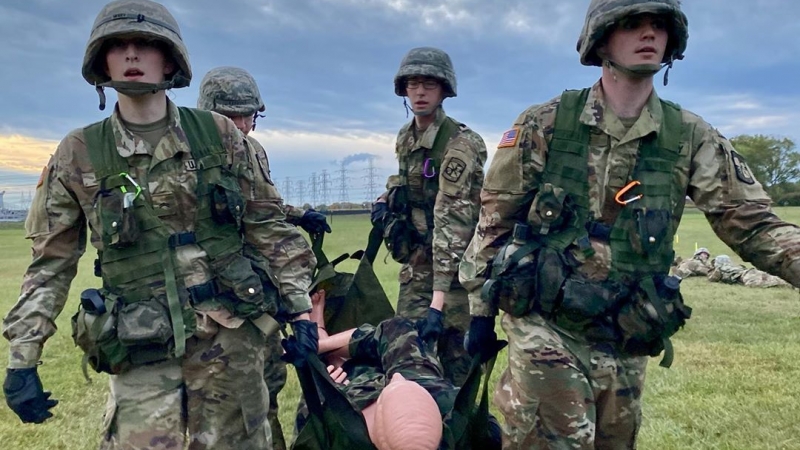Prospective Students Cadets carrying injured soldier