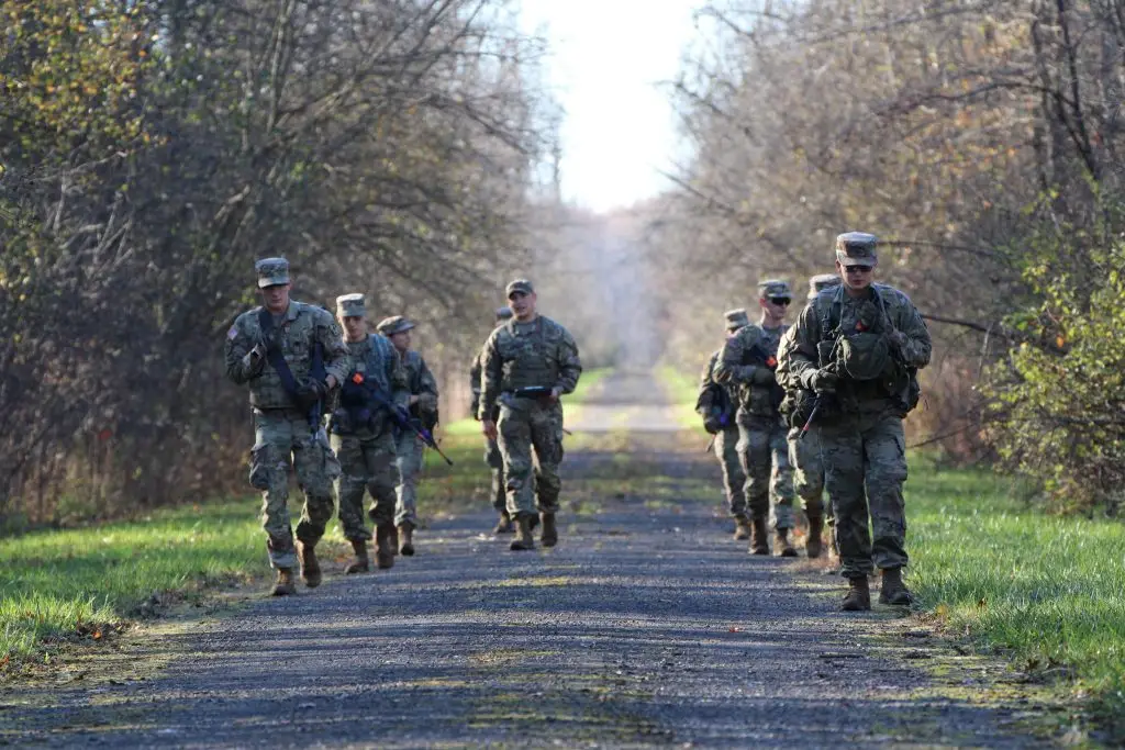 Cadets walking on a gravel trail in the woods