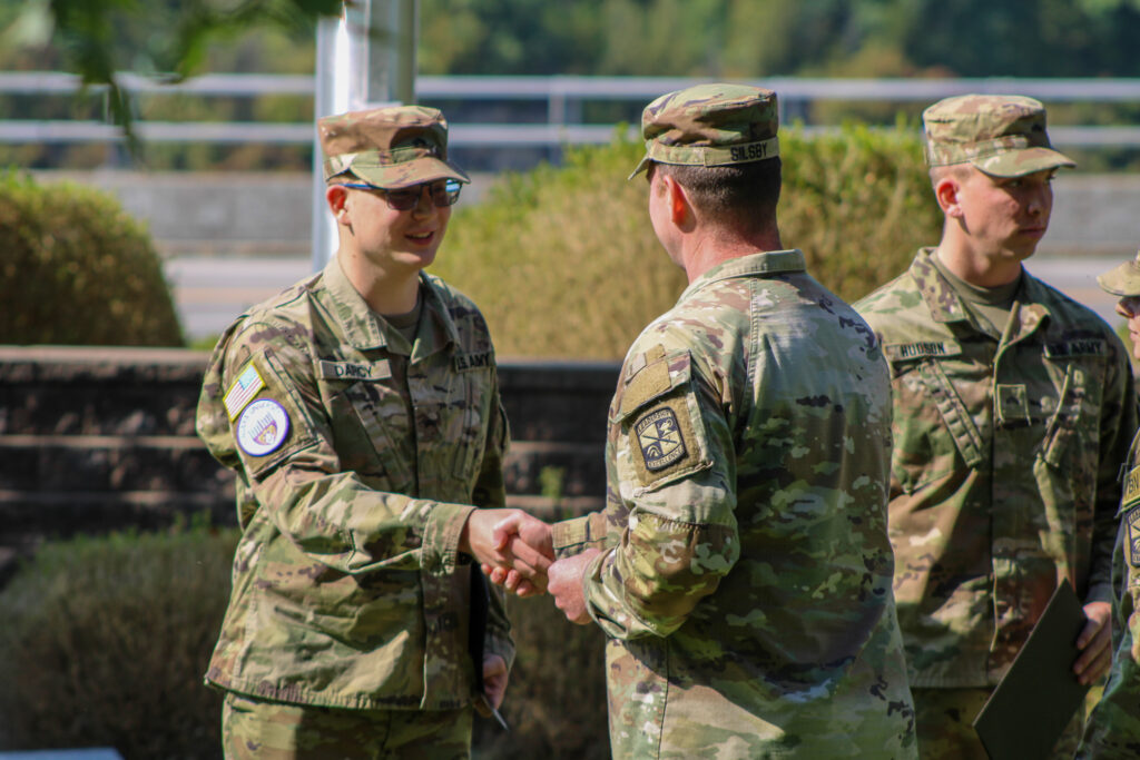 Cadet shaking a officers hand