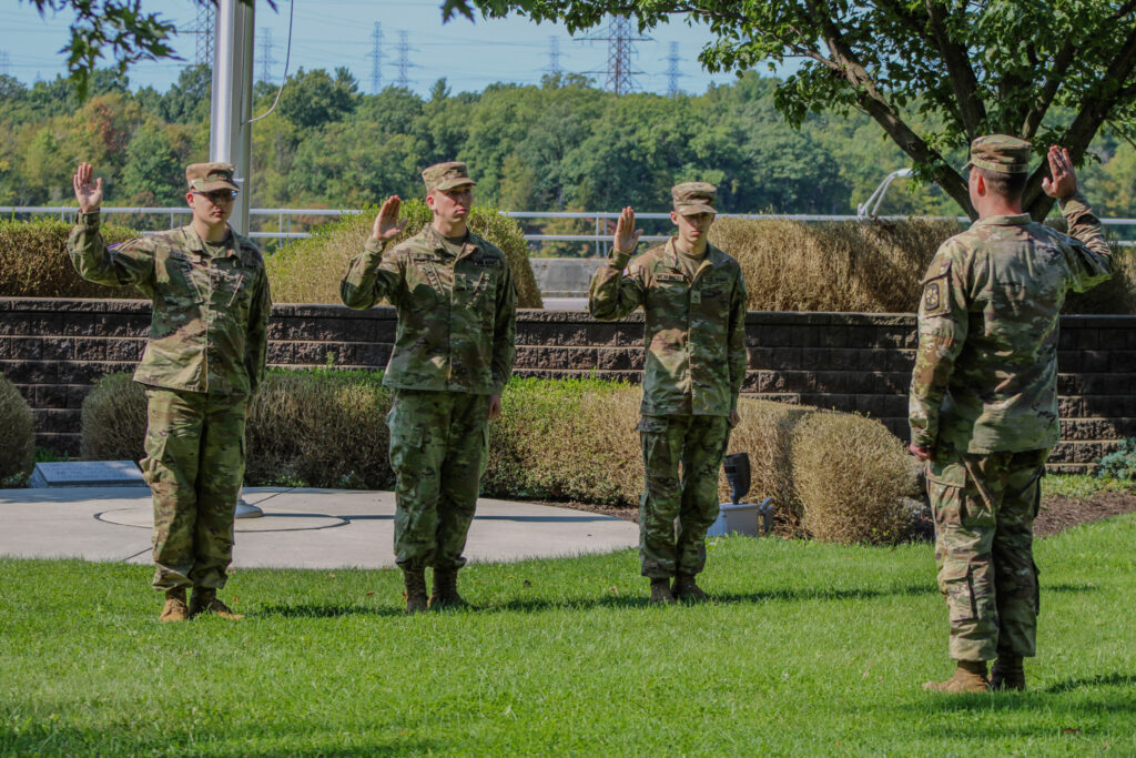 Niagara University Army ROTC Cadets raising their hands and being sworn in by officer